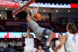 Houston's defense runs supreme in 77-48 victory against WVU